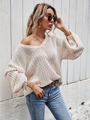 Open-knit sweater in Ivory with V-neck and balloon sleeves, featuring a relaxed fit.