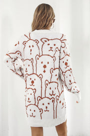 White knit dress with allover brown bear motif, crew neck, long sleeves.