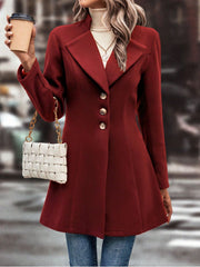 Flared hemline wool coat in deep red with button closure and tailored fit.