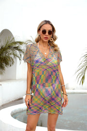 Open-knit caftan with V-neck and short sleeves in a colorful rainbow pattern.