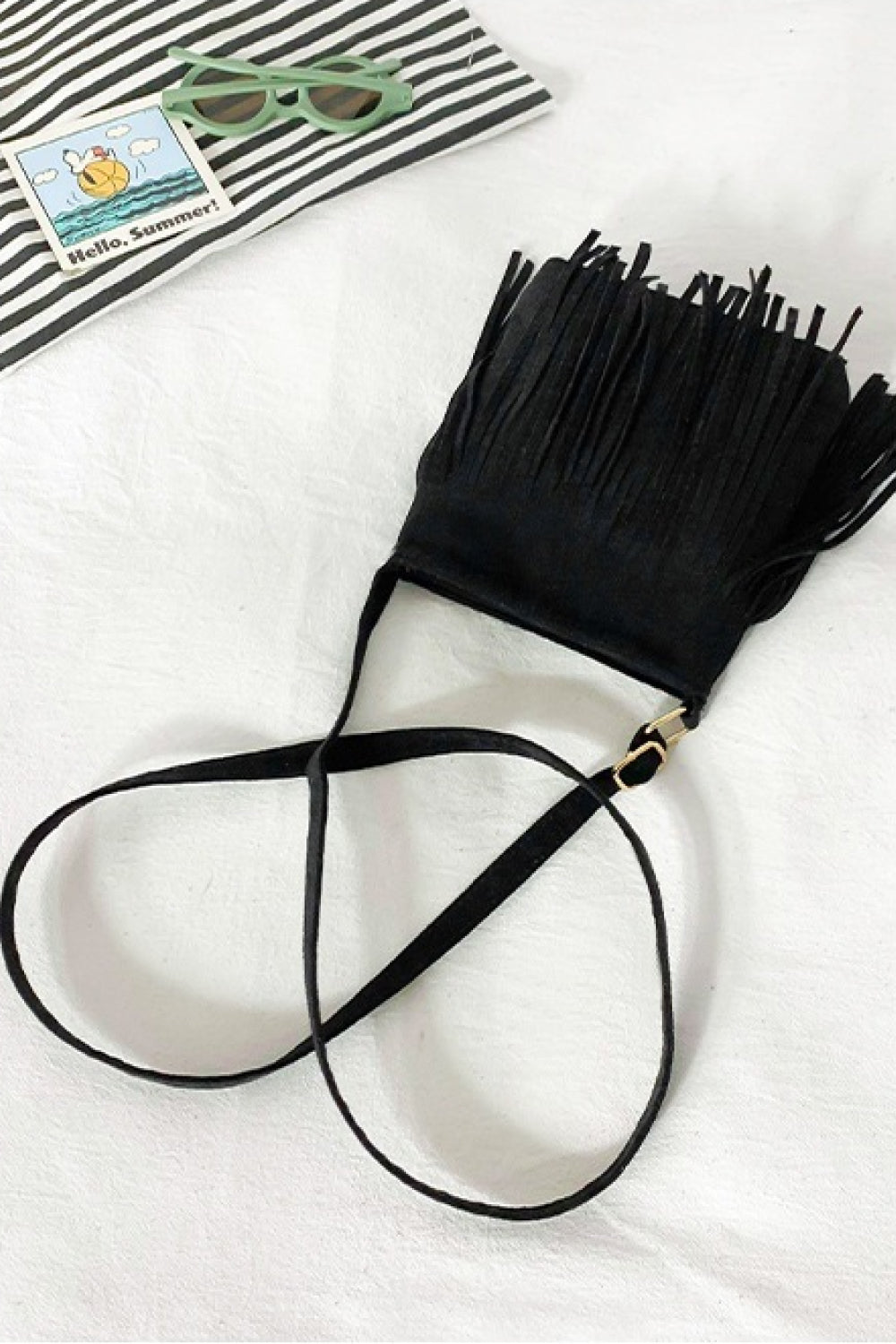 Black crossbody bag with fringe detail and adjustable strap