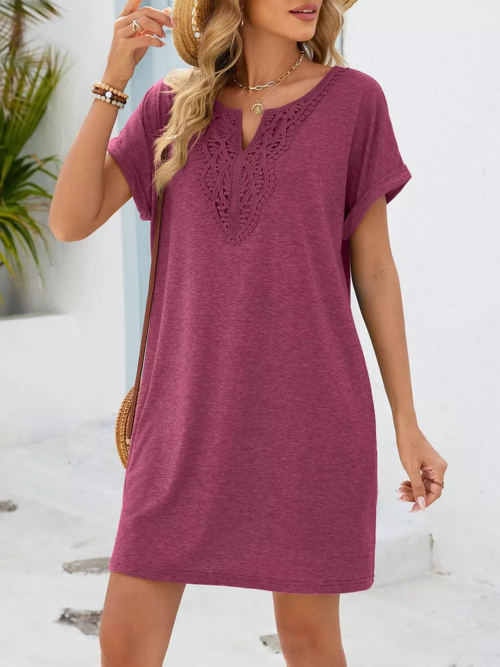 Deep purple V-neck dress with lace yoke detail and short sleeves.