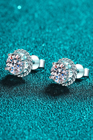 Sterling silver stud earrings with moissanite and rope-inspired framing.