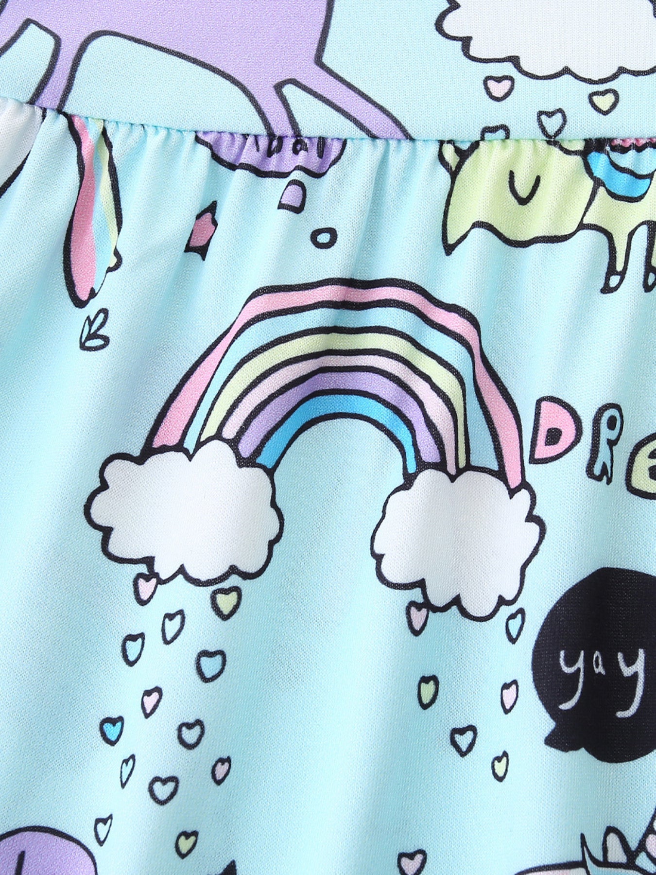Baby dress with rainbow, unicorn and dinosaur print on light blue fabric.
