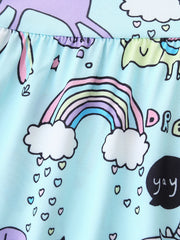 Baby dress with rainbow, unicorn and dinosaur print on light blue fabric.