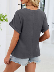 Gray waffle knit t-shirt with cuffed short sleeves and a relaxed fit.