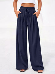 Dark blue high-waisted pleated pants with drawstring and pockets