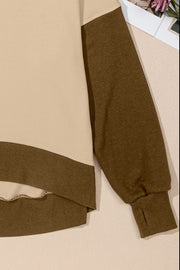 Crewneck sweatshirt with tan body and brown sleeves, featuring contrast trim and thumbholes.