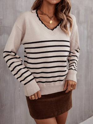 Beige and black striped knit sweater with scalloped trim and V-neck.