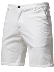 White chino shorts with elastic waist and button closure.