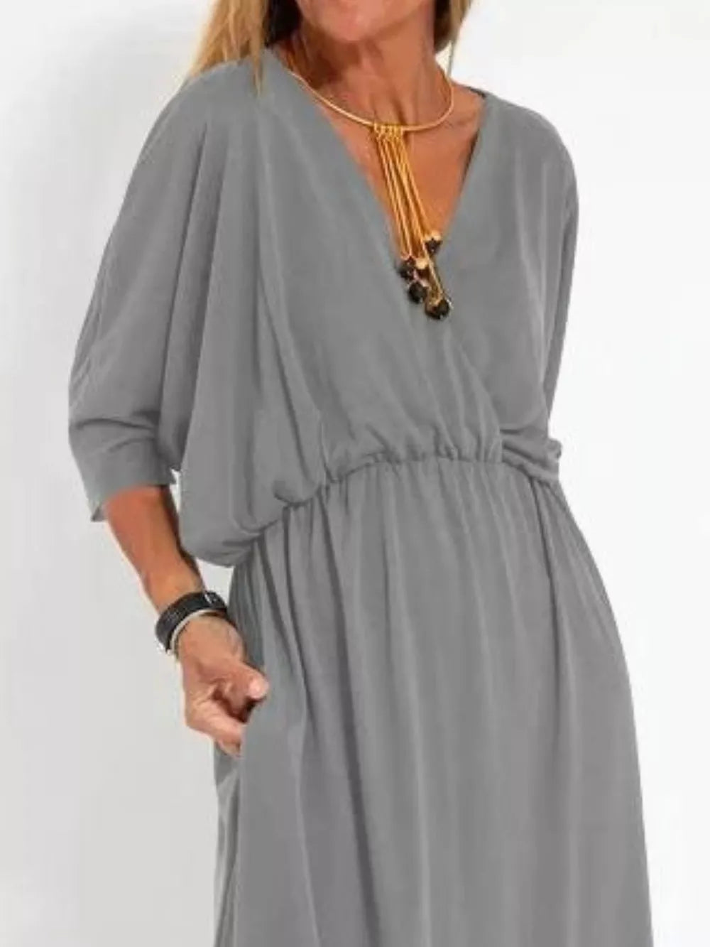 Gray V-neck maxi dress with dolman sleeves, elastic waist, and side slits.