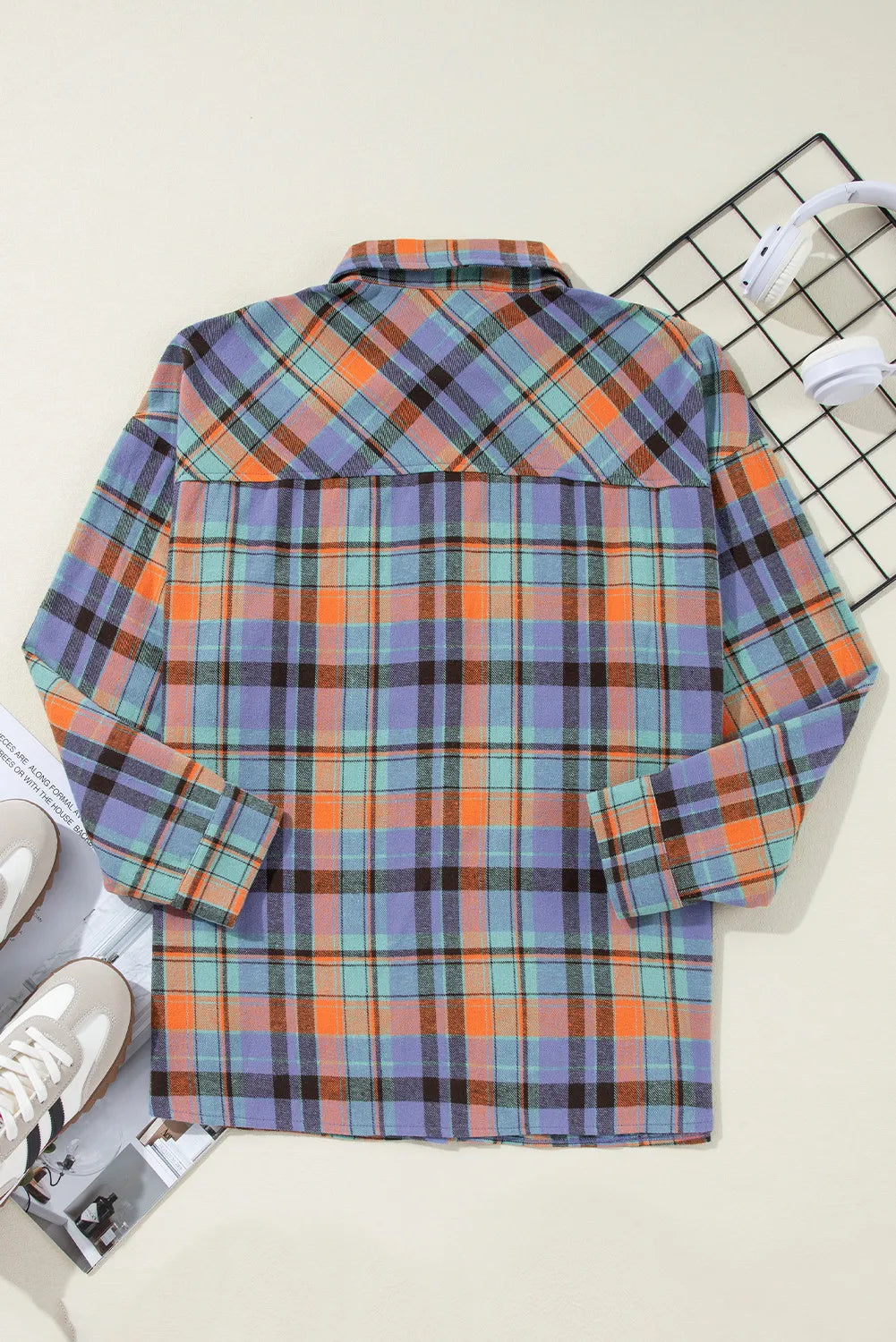 Oversized plaid shacket with button-down collar in orange and purple check.