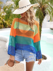 Rainbow mesh cover-up with flared sleeves in orange, green, turquoise, and blue stripes.