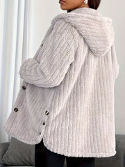 Light grey button-up fleece jacket with hood and textured fabric.