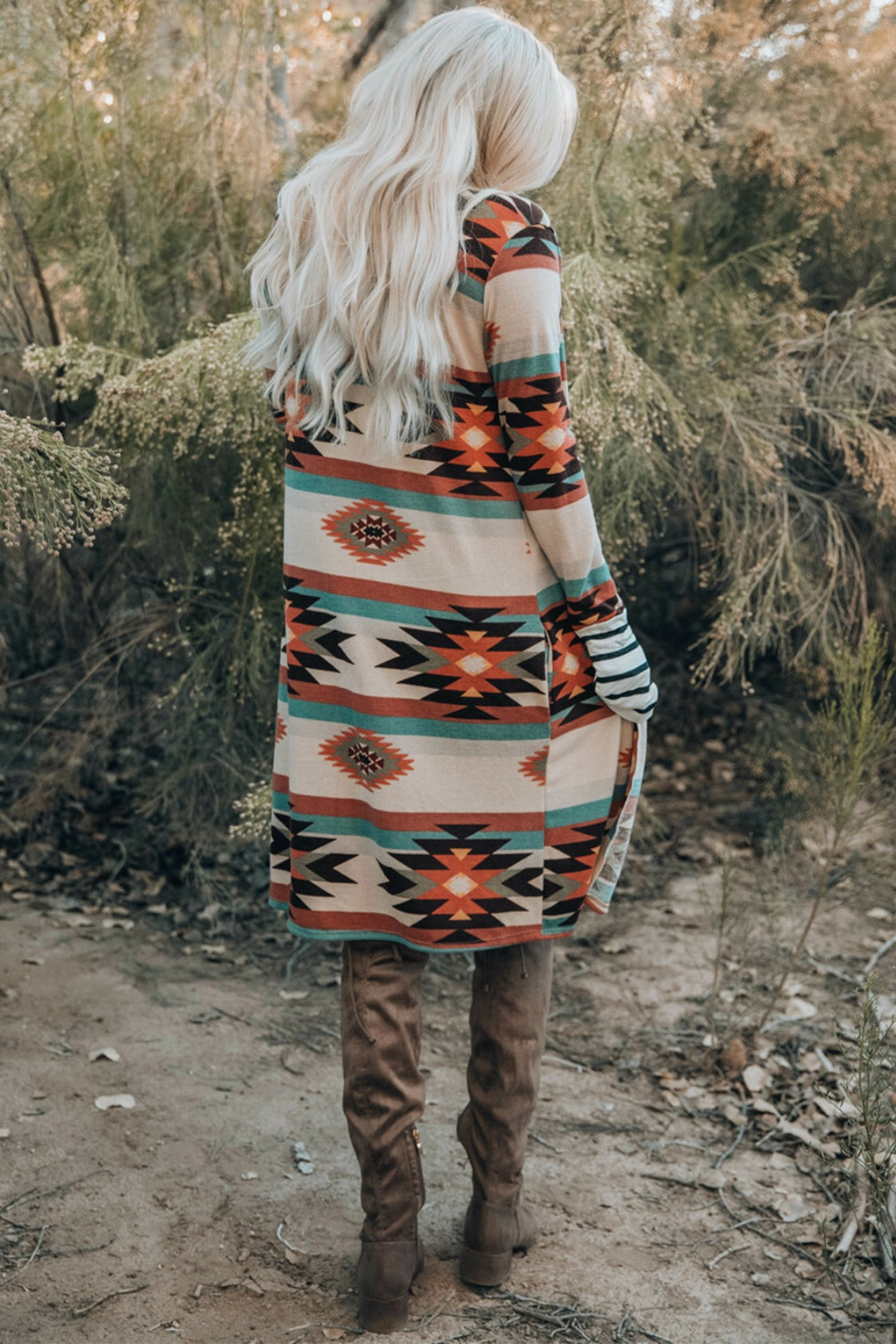 Southwestern print duster cardigan with stripe cuff sleeves and side slits.