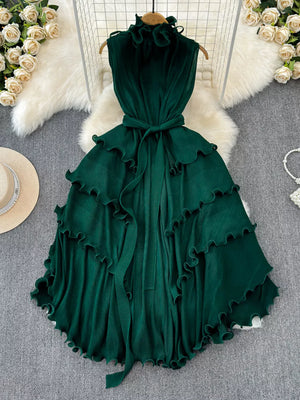Dark green ruffled tiered midi dress with belted waist and frill neckline.