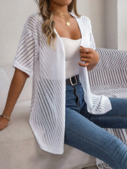 White open-knit slouchy cardigan with short sleeves and diagonal stitch detail.