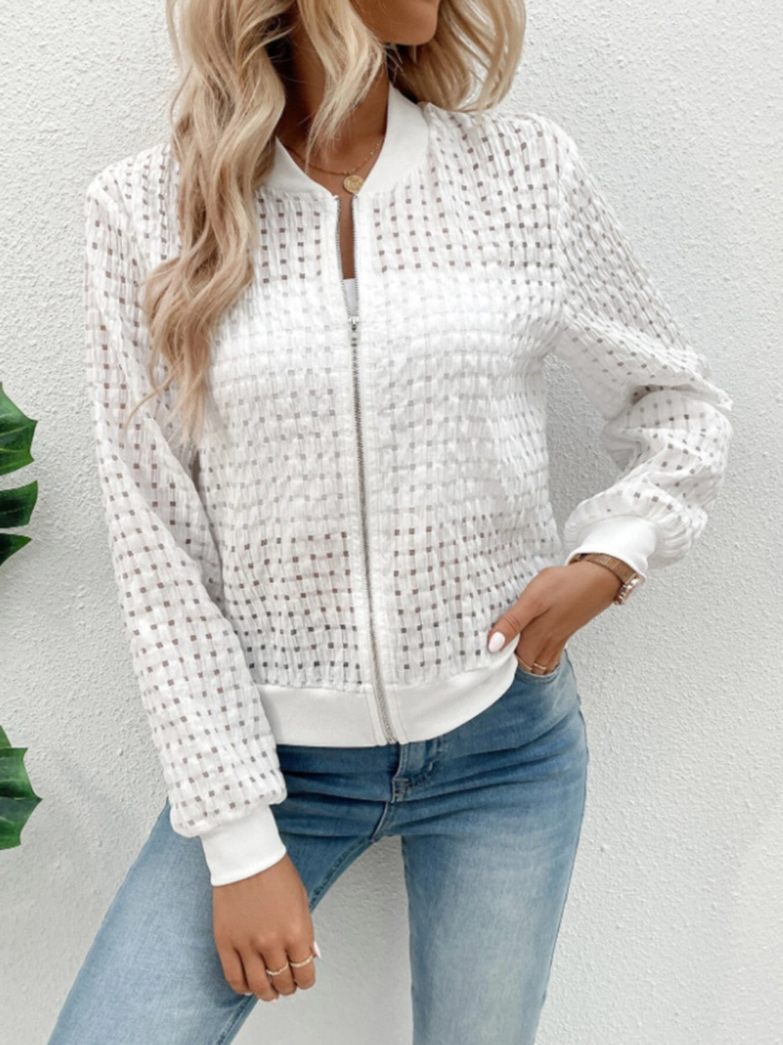 White textured mesh bomber jacket with a checkered pattern and ribbed cuffs.