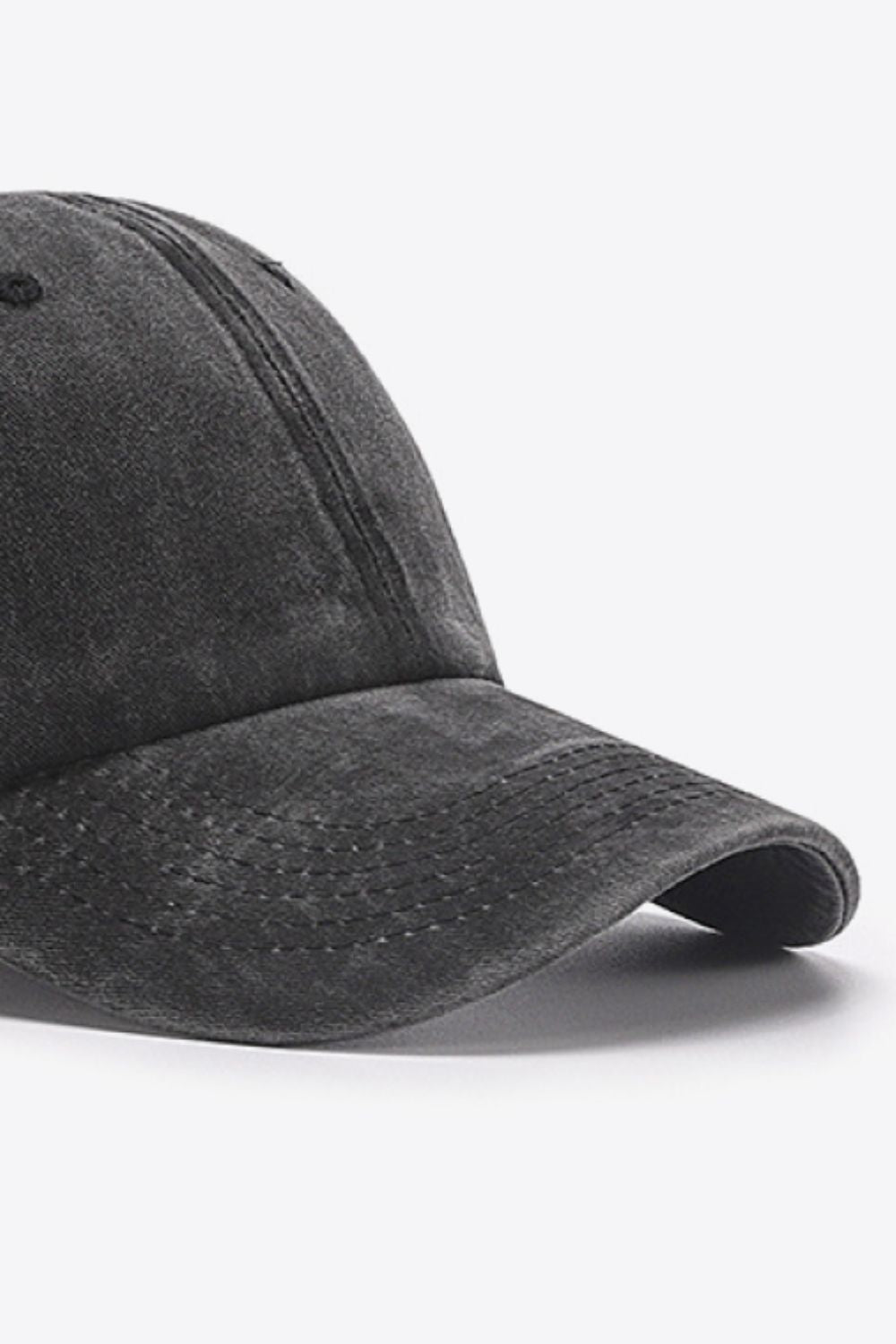 Washed cotton baseball cap in black with a curved brim and stitched details.