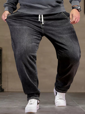 Black 100% cotton jeans with drawstring waist and relaxed fit.
