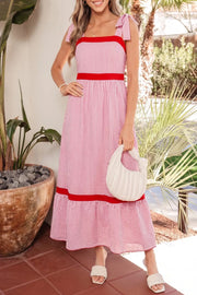 Pink striped cotton maxi dress with red trim, square neckline, and bow knot straps.