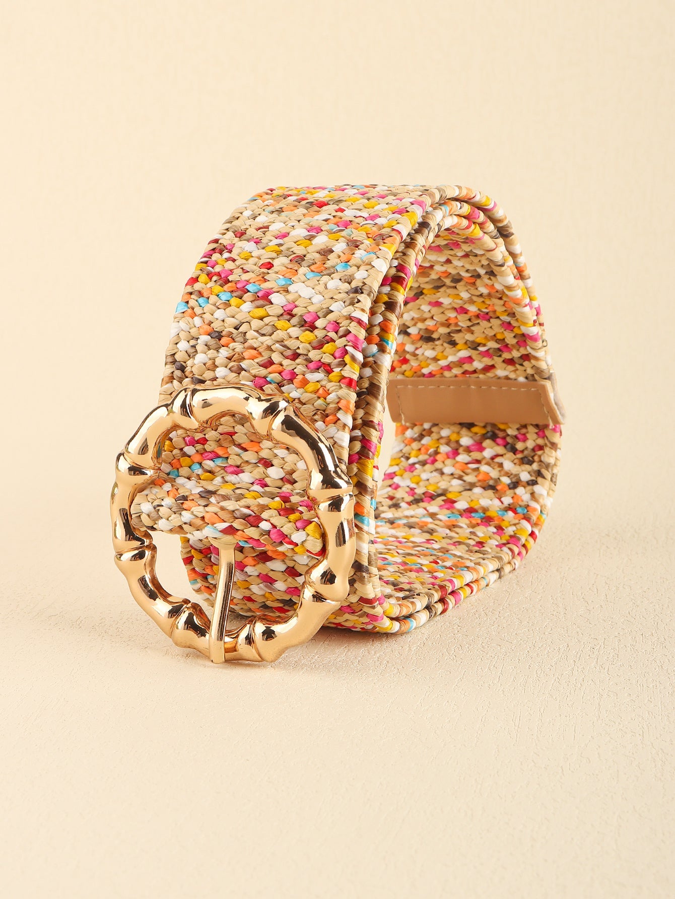 Multicolor woven raffia belt with a gold bamboo-style buckle.