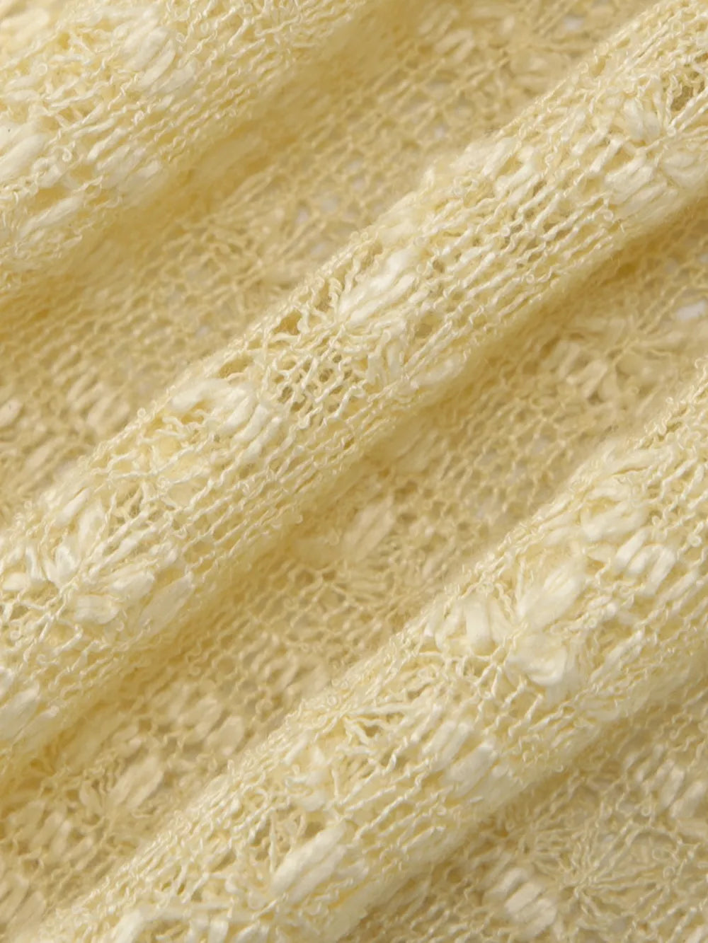 Yellow sheer one-shoulder cropped cardigan with open knit texture