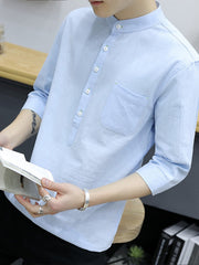 Sky blue cotton shirt with button detail, mandarin collar, and chest pocket.