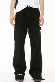 Black bootcut denim pants with zip hem detail and utility pockets.