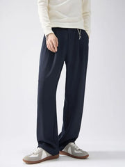 Navy blue drawstring wide-leg sweatpants with a chain detail.
