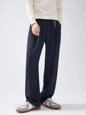 Navy blue drawstring wide-leg sweatpants with a chain detail.