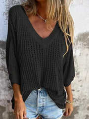 Black open-knit V-neck sweater with relaxed fit and 3/4 sleeves, styled with denim shorts.