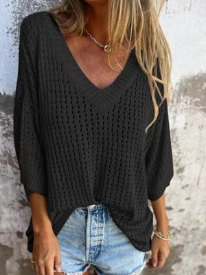 Black open-knit V-neck sweater with relaxed fit and 3/4 sleeves, styled with denim shorts.