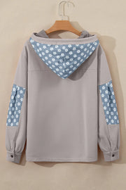 Tan floral patchwork hoodie with a hood and button cuffs.
