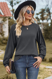 Dark Gray waffle knit eyelet raglan sleeve top with crew neck and balloon sleeves
