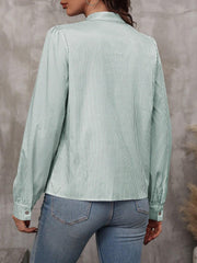 Green striped puff sleeve blouse with neck tie detail.