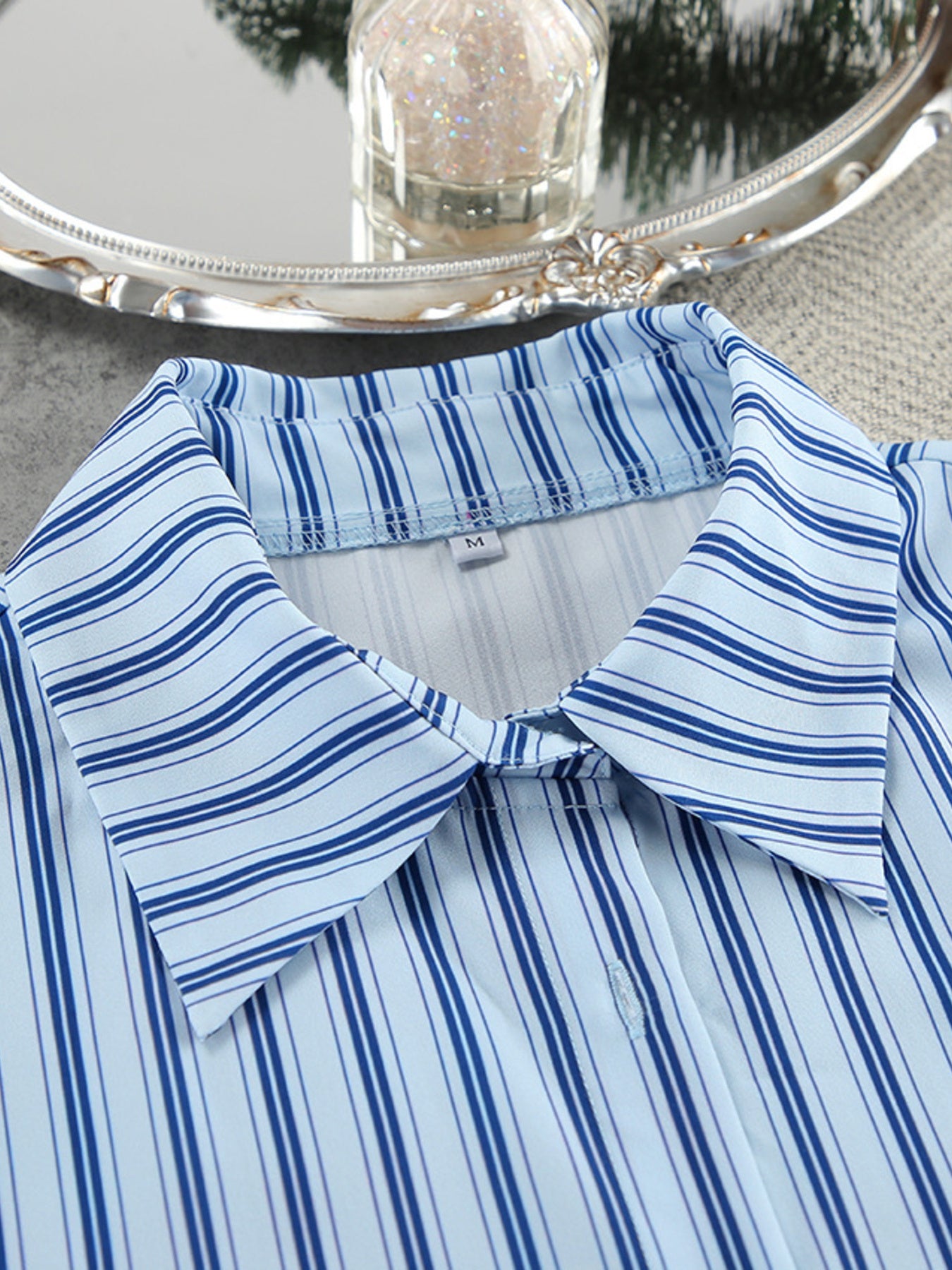 Light blue and navy striped button-up pajama shirt with a classic collar.