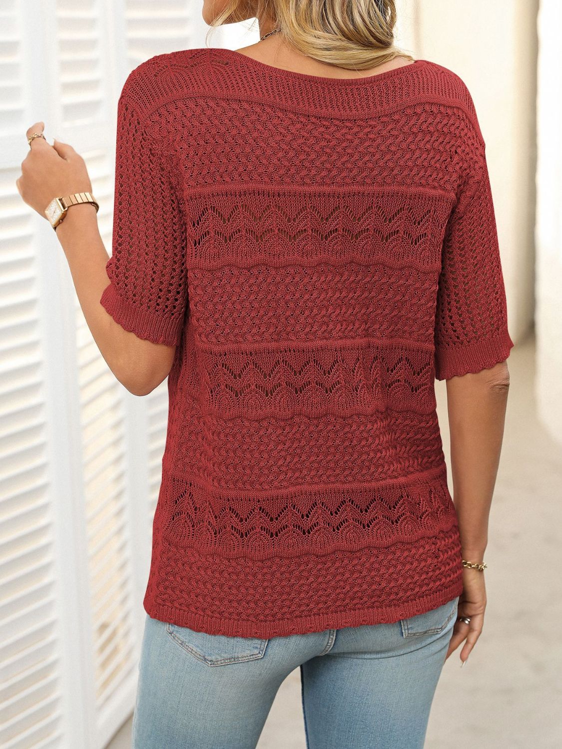 Burgundy knit sweater with half sleeves and openwork patterns.