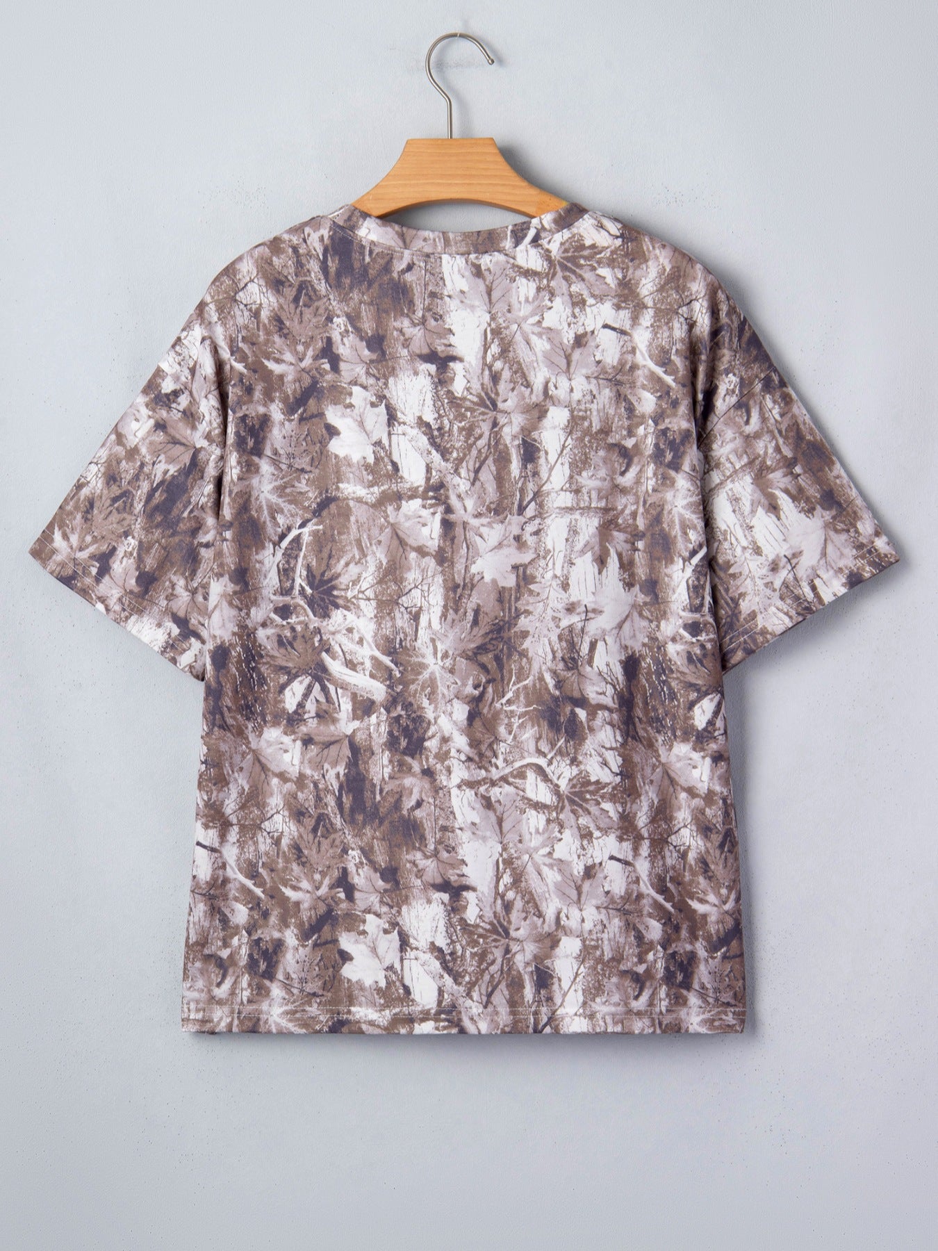 Woodland camouflage tunic with crew neck and short sleeves.