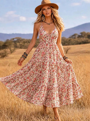 Floral midi dress with V-neck and tiered skirt.