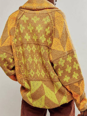 Geometric patchwork knit cardigan in brown and yellow with a shawl collar.