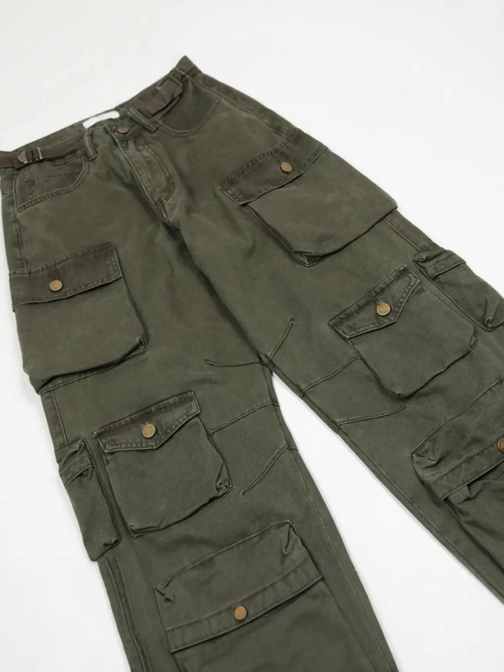 Dark green cargo pants with multiple buttoned pockets and a belt.
