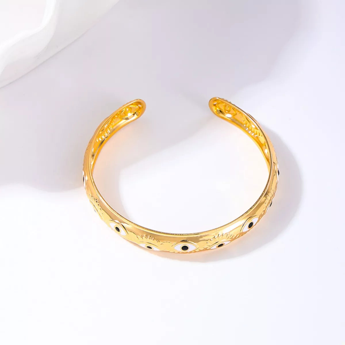 Golden evil eye bangle bracelet with 18K gold plating