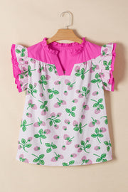 Strawberry print cotton blend blouse with flutter sleeves and pink color block yoke.