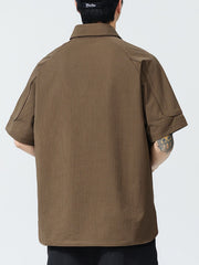 Brown textured short sleeve polo shirt with button-down collar and casual fit.