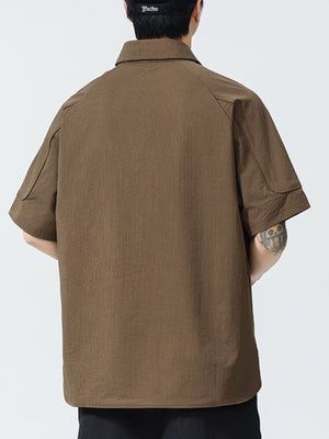 Brown textured short sleeve polo shirt with button-down collar and casual fit.