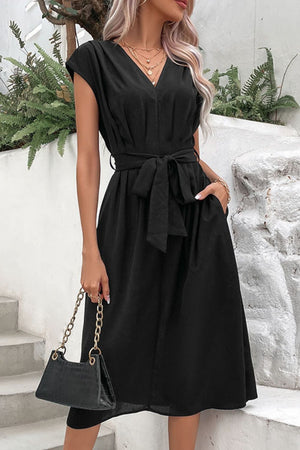 Black cap sleeve wrap midi dress with tie belt and pockets.
