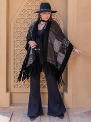 Black patchwork print kimono with fringe details and a relaxed fit.