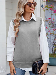 Gray ribbed knit vest with crewneck and side buttons, layered over a white collared shirt.