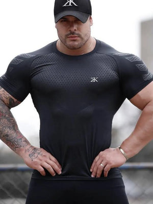 Black performance mesh sculpt tee with textured shoulder detail and logo.